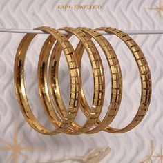 Set of 2 gold plated kangans  we have in size 2.4, 2.6, 2.8  please check the chart and message me Gold Tarnish-resistant Round Bangle, Gold Tarnish Resistant Hoop Bracelets, Tarnish Resistant Hoop Gold Bracelets, Stackable Round Gold Bracelet, Tarnish Resistant Gold Round Bangle, Gold Hoop Bracelet For Anniversary, Gold-plated Stackable Gold Bangle, Gold Stackable Bangle, Adjustable Gold Hallmarked Bangle