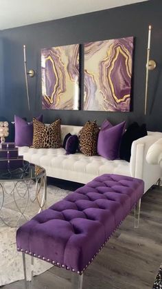 a living room with purple and white furniture