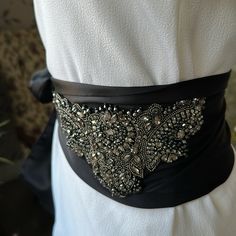 I Have A Few Left From Various Shows This Amazing Must Have In Wardrobe You Can Glamorize Simple Teeshirt And Go Upscale Made With Crystals Italy And Silk France 6.5 Inches Wide And 70" Long Black Color Wedding Black Fitted Corset Belt, Black Corset Belt For Evening, Party Satin Corset Belt, Elegant Black Corset Belt For Party, Silver Fitted Sash For Party, Fitted Silver Sash For Party, Elegant Black Party Belt, Formal Black Embroidered Belt, Embellished Fitted Sash For Party