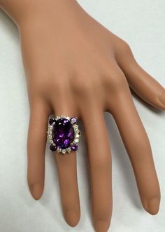 16.85 Carats Natural Amethyst and Diamond 14K Solid Yellow Gold Ring Suggested Replacement Value: $6,700.00 Total Natural Oval Shaped Amethyst Weights: Approx. 16.00 Carats Natural Round Diamonds Weight: Approx. 0.85 Carats (color G-H / Clarity SI1-SI2) Ring total weight: Approx. 12.00 grams Disclaimer: all weights, measurements and colors are approximate and may vary slightly from the listed dimensions or as seen in the image. All pictures are magnified to show the smallest of details. Please, Luxury Multi-stone Amethyst Wedding Ring, Elegant Multi-stone Amethyst Ring Gift, Luxury Multi-stone Amethyst Jewelry, Luxury Amethyst Multi-stone Jewelry, Purple Amethyst Rings For Formal Occasions, Luxury Purple Rings For Party, Luxury Purple Party Rings, Luxury White Gold Amethyst Ring With Gemstone Accents, Formal Purple Amethyst Ring With Gemstone Accents