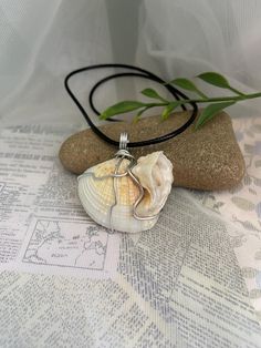 This simple but elegant necklace is made from a white seashell that is wire wrapped and hung on an 18" wax cord necklace with a 2" extension chain for adjusting the size. This shell has a unique shape to it and is just so beautiful! It makes the perfect addition to any summer outfit and any beach day! Orders within Canada are sent via oversized lettermail (no tracking) to keep shipping costs low. Tracking is available at the checkout for an extra fee.  Orders to the US are sent via tracked packe Wax Cord Necklace, Seashell Jewelry, Seashell Necklace, Elegant Necklace, Shell Jewelry, Elegant Necklaces, Cord Necklace, Sea Shell, Beach Day