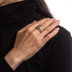 Finely detailed antique Victorian family crest signet ring (circa 1898), crafted in 10 karat yellow gold.   The oval signet mount features a family crest with the year '1898' to the base. The side shoulders feature a pretty etched foliate design. The low rise ring (3.5mm - 0.13 inches) sits comfortably on the finger.    The ring is in good condition with some wear evident. We have not cleaned it in order to preserve patina and collector value.   Particulars:  Weight: 13.5 grammes  Stones:  N/A Gold Oval Signet Ring With Coat Of Arms, Formal Gold Signet Ring With Coat Of Arms, Classic Yellow Gold Engraved Ring With Coat Of Arms, Formal Yellow Gold Signet Ring With Coat Of Arms, Classic Signet Ring With Coat Of Arms For Anniversary, Classic Oval Signet Ring With Coat Of Arms, Victorian Oval Signet Ring With Polished Finish, Heirloom Oval Signet Ring With Coat Of Arms, Luxury Yellow Gold Coat Of Arms Signet Ring