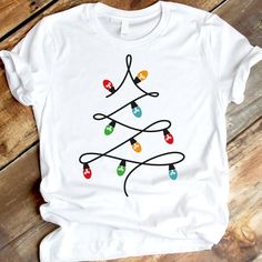 a white t - shirt with christmas lights on it