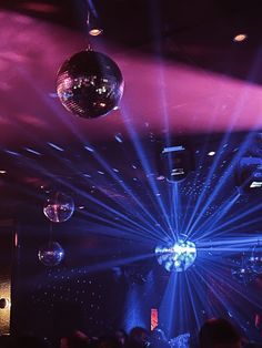 disco ball lights in the middle of a dance floor