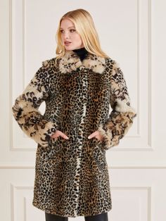 Faux fur coat. Classic collar. Long sleeves. Front button fastening. Regular fit. FABRIC DETAILS: Animalier print. Front pockets. Picture shows size 40. Total lenght: 92 cm / 36.22 inch. Sleeve lenght: 62,5 cm / 24.61 inch. SHELL (main fabric): 38% Acrylic, 37% Modacrylic, 25% Polyester; LINING: 100% Polyester; SLEEVES AND COLLAR: 53% Modacrylic, 27% Acrylic, 20% Polyester. WASH LABEL: Dry clean. This item for safety for the store cut in half or marked with black marker the labels to avoid retur Luxury Long Sleeve Leopard Print Outerwear, Luxury Leopard Print Outerwear For Fall, Luxury Faux Fur Spring Coat, Trendy Long Faux Fur Coat, Chic Leopard Print Winter Outerwear, Elegant Leopard Print Outerwear For Winter, Elegant Leopard Print Winter Outerwear, Elegant Winter Leopard Print Outerwear, Luxury Spring Outerwear With Faux Fur Lining