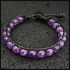 This gemstone bracelet made with 8 mm round shaped original Purple Amethyst beads. It is a perfect gift for you and all your loved one for all special days. We creat stylish and unique designed bracelets in fashion for you with high quality gemstones. All our designs prepared by hand according to the your given sizes with love. Wrap is durable 1,5 mm polyester black rope. For closure of our high quality bracelet we used zamak alloys button with 2 optional closure buttonhole. Used materials; 8 mm Adjustable Purple Spiritual Bracelets, Adjustable Hand-wrapped Purple Beaded Bracelet, Adjustable Purple Beaded Spiritual Bracelets, Adjustable Purple Beaded Bracelets For Meditation, Adjustable Purple Spiritual Beaded Bracelets, Adjustable Purple Beaded Bracelets For Healing, Adjustable Hand Wrapped Purple Bracelets, Adjustable Purple Crystal Spiritual Bracelet, Purple Bohemian Round Bracelet