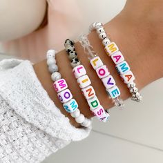 "Brand new to the Louis and Finn shop -- how FUN are these custom beaded name bracelets with colorful square letters! All bracelets are a colorful mixture of pastel letter beads on a chunky square as shown. You just pick the style of the band: silver, crystal, leopard or white marble! Use your name, initials, your kiddos, pet names, motivation words, phrases -- options are endless! These also make perfect gifts for -- mamas to be, baby shower, bridal, bachelorette party, best friends, etc. ≫ PRO Cute White Name Bracelet With Colorful Beads, Personalized White Name Bracelet With Colorful Beads, Multicolor Letter Beads Name Bracelet As Personalized Gift, Multicolor Crystal Bracelet With Letter Beads, Square Letters, Playful Multicolor Letter Beads Name Bracelet, Party Best Friends, Motivation Words, Word Bracelets