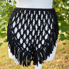 Macrame Festival Shorts - a perfect choice for Tomorrowland and beach party extravaganzas. This black boho-style shorts ensemble is your go-to for a fashionable birthday outfit, ensuring you stand out with style at every celebration. Information: * Material: polyester cord. * Color: black - ready to ship.  * Size: s-m. * Handmade by myself in Lithuania, Europe. * Size s-m in black is ready to ship. For other sizes or other colors - please contact me by messages here on Etsy.  Care recommendations: hand-wash only with soup, no tumble dry, lay the garment out to dry on the flat surface, like a sofa, table or countertop. Shipping: ready to ship item will be dispatched in 1-3 business days. Made to order items may take additional 3-7 business depending on cord availability and your request det Bohemian Shorts For Summer Beach Party, Bohemian Style Shorts For Beach Party, Bohemian Style Short Bottoms For Beach Party, Hippie Beach Shorts For Summer, Hippie Beach Shorts, Bohemian Shorts For Beach Party In Spring, Bohemian Style Shorts For Beach Party In Spring, Bohemian Shorts For The Beach, Bohemian Style Beach Shorts