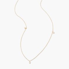 This Juliet 14K Gold Floating Diamond Necklace is a sparkly sensation. With three floating diamonds encased in luxurious 14K gold, this necklace adds a touch of sophistication and glamour to your look - you deserve it! Available in 14k yellow gold Pendant size: 1/8" Lab Grown Diamonds Diamond size: 1.7mm round diamond 16" cable chain with 2" extender Spring ring closure SKU: BYND0008 Delicate Yellow Gold Diamond Necklace With Single Cut Diamonds, Dainty Yellow Gold Diamond Necklace With Single Cut Diamonds, Dainty Yellow Gold Diamond Birthstone Necklace, Gold 14k Diamond Necklace With Single Diamond, Delicate Gold Diamond Necklace With Single Cut Diamonds, Delicate Yellow Gold Diamond Necklace With Brilliant Cut, Delicate Yellow Gold Diamond Cut Necklace, Fine Jewelry Diamond Necklace With Delicate 14k Gold Chain, 14k Gold Diamond Necklace With Delicate Chain