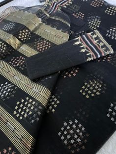 "This beautiful handmade Dhakai Jamdani Saree all the way from original traditional craftsman from Bangladesh \"Jamdani (Bengali: জামদানি) is a fine muslin textile produced for centuries in South Rupshi of Narayanganj district in Bangladesh. \" Product Description: Saree Type :Jamdani Thread Count: 84 Blouse Piece : Have Blouse Piece (Unstitched) Pico: Done Saree Fabric : Half Silk Color : As shown in the photo Disclaimer: slightly color variations may be possible due to light effects!" Ceremonial Cotton Silk Traditional Wear With Cutdana, Handloom Raw Silk Blouse Piece For Traditional Ceremonies, Black Handloom Traditional Wear For Eid, Black Raw Silk Dupatta For Traditional Ceremonies, Artisan Dupatta With Motifs For Festivals, Unstitched Bohemian Traditional Wear With Woven Motifs, Artisan Handloom Dupatta For Festivals, Multicolor Traditional Wear With Weaving For Eid, Black Traditional Wear With Traditional Patterns In Raw Silk