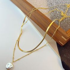 Color: F7791 Double-Layer Pearl Necklace Fashion Element: Ring Style: Cold Wind Elegant Layered Necklace With Adjustable Chain, Elegant Round Layered Necklace With Adjustable Chain, Elegant Layered Necklace With Double Chain And Round Pendant, Elegant Alloy Chain Necklace For Wedding, Elegant Metal Jewelry With Double Chain, Elegant Metal Double Chain Jewelry, Elegant Gold Alloy Chain Necklace, Gold Alloy Long Necklace, Elegant Silver Round Layered Necklace