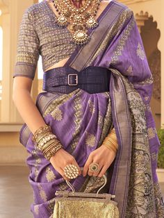 Step into the spotlight with our glamorous purple printed silk wedding wear saree with blouse. This stunning ensemble features a vibrant purple color with intricate printwork and threadwork, making it the perfect choice for weddings, festivals, and other special occasions.
The saree is crafted from high-quality silk fabric, providing a luxurious look and feel. This saree is sure to turn heads and make you feel like a queen at any event.
The elegant design and vibrant color make it a standout cho Festive Purple Silk Pre-draped Saree, Purple Art Silk Pre-draped Saree With Self Design, Traditional Purple Pre-draped Saree For Navratri, Purple Handloom Pre-draped Saree For Diwali, Bollywood Style Purple Handloom Pre-draped Saree, Purple Art Silk Pre-draped Saree For Navratri, Purple Choli For Eid, Anarkali-style Pre-draped Saree With Pallu In Purple, Traditional Purple Pre-draped Saree