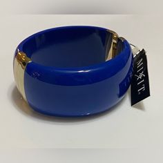 Bold Blue With Gold Accents Bangle Blue Cuff Bracelet Bangle For Formal Occasions, Blue Bangle Cuff Bracelet For Formal Occasions, Trendy Blue Formal Jewelry, Elegant Blue Bracelets For Spring, Blue Bangle Cuff Bracelet For Party, Formal Blue Bangle Cuff Bracelet, Chic Blue Jewelry For Formal Occasions, Spring Party Blue Bracelets, Trendy Adjustable Blue Cuff Bracelet