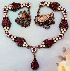 Michal Negrin floral necklace. With icy and sparkling peach and deep red Swarovski crystals. Each flower measures about 0.3 inch in diameter. The chain length is adjustable. New in a gift box. For rare Michal Negrin items that can only be found in my eBay store, please visit AC Designer Outlet Combined shipping is only $5 for each additional item. Red Jewelry With Lobster Clasp For Party, Red Party Jewelry With Lobster Clasp, Red Pendant Necklace With Lobster Clasp, Elegant Red Jewelry With Chain Detail, Elegant Red Chain Jewelry, Elegant Red Chain Necklace For Party, Red Pendant Chain Jewelry, Red Long Necklace With Adjustable Chain, Vintage Necklace With Adjustable Chain For Valentine's Day