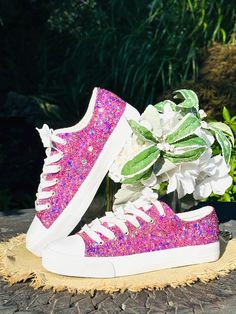 Hand Glittered unbranded canvas sneakers glittered in a gorgeous pink and blue glitter mix called 'Cotton Candy'.  Made to order. If you normally wear a 1/2 size, we recommend you size up to the next whole size for a comfortable fit. Production time is approximately 1-2 weeks.   If you need your sneakers sooner, please select the 'Rush' option with your selection from the drop down menu for 5-7 day processing. Glitter is high quality and heat set for minimal glitter loss and lasting quality, though, you may see glitter shedding the first time you wear/try on your shoes.  Although we aim to remove every loose piece of glitter prior to shipment, the shipping process s well as putting them on and adjusting the laces can disrupt the glitter and cause some to flake. This is normal for the first Pink Low-top Sneakers For Birthday, Casual Pink Sneakers For Birthday, Purple Round Toe Party Sneakers, Spring Party Sneakers With Glitter Accents, Party Sneakers With Glitter Print And Round Toe, Party Sneakers With Sequins And Round Toe, Pink Lace-up Sneakers For Birthday, Pink Glitter Accent Sneakers For Spring, Pink Sneakers With Glitter Print For Spring