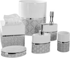 the bathroom accessories are all white and silver