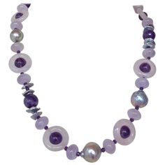 Beautiful stone necklace by Marina J. This lovely piece is made using multi shaped faceted Amethysts and Rose Quartz all adorned by 14k White Gold plated Silver Vermeil findings & Freshwater Grey Pearls which display a vivid sheen and iridescence. Due to their translucent and faceted nature, the Amethyst and Rose Quartz radiate great hues of color and sparkle when hit with light! Measuring 22 inches long, this necklace meets at a 14k White Gold Plated Silver Lobster Clasp, which perfectly accent Grey Pearl Necklace, 1st Dibs, Infinity Necklace, Mineral Collection, Crown Jewels, Quartz Rose, Pearl Grey, Gold Plated Silver, Stone Necklace