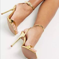 New Never Worn Modern Gold Open Heel Heels, Trendy Gold High Heels, Sleek Gold Open Toe Heels, Gold Sleek Open Toe Heels, Sleek Gold Heels With Padded Heel, Modern Gold Ankle Strap Heels, Sleek Gold Heels With Wrapped Heel, Sleek Gold Sandals With Pointed Toe, Modern Gold Heels With Wrapped Heel