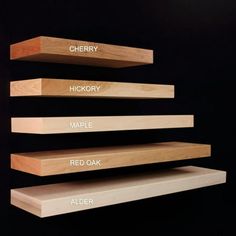 three wooden shelves with different types of wood on them, labeled cherry, hickory, maple, red oak and alder