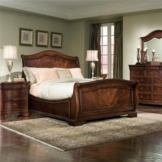 a bedroom scene with focus on the bed and dresser