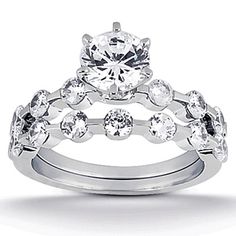 a white gold diamond ring and matching wedding band