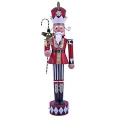 a nutcracker with a candy cane in his hand is standing on a white background