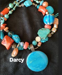 "Darcy" Bigger is always better.. especially in jewelry!  This unique art necklace has it all going for it including a large turquoise pendant. I have added various shapes of turquoise and coral to this one of a kind piece, along with hand painted lamp work, clay and glass beads.  Also added is a wire wrapped tumbled stone dangle for a little funk.    A show stopper! Size definitely matters.. This necklace measures 23 inches from clasp to clasp. Fast Free Shipping Your jewelry should always make you smile. Item # 377 Coral Art, Art Necklaces, Custom Pendants, Coral Turquoise, Turquoise Pendant, Silver Stars, Star Necklace, Handmade Artisan, Chain Styles