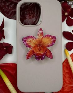 a cell phone case with a flower on it