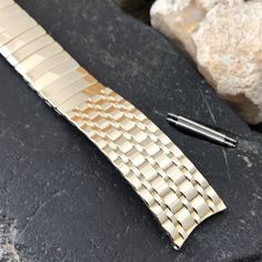 "NOS unused 1950s-1960s old-stock Admiral 1/20 10k yellow gold-filled scissor-expansion watch bracelet. This is a high-quality out of production USA made vintage watchband. The ends are curved and measure 11/16\" (17.25mm). Spring bars are included. The length measured at the spring bars is 5 7/8\" (149mm) with (1) 3/8\" removable link. 39A.15522  Visit our store for more unused vintage watch bands, bracelets, straps, buckles, and links." Bands Bracelets, Watch Bracelet, Vintage Band, Pig Skin, Gold Style, Cool Watches, Vintage Watches, Watch Band, The Expanse