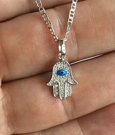 "925 STERLING SILVER HAMSA AND EVIL EYE PENDANT . HAMSA AND EVIL EYE FOR PROTECTION AND GOOD LUCK. 16\" LONG GUCCI CHAIN. PENDANT SIZE 20 X 10 mm CADENA DE 925 PLATA ESTERLINA MANO DE FATIMA Y OJO DE LA BUENA SUERTE. LA MANO DE FATIMA Y OJO PARA BUENA SUERTE Y PROTECCION. 16\" LARGO GUCCI CADENA .. TAMAÑO DEL DIJE : 20 X 10 mm" Sterling Silver Good Luck Charms Necklace, Sterling Silver Pendant Charm Necklace For Good Luck, Sterling Silver Round Pendant Charm Necklace For Good Luck, Sterling Silver Charm Necklace For Good Luck, Symbolic Sterling Silver Good Luck Charm Necklace, Spiritual Sterling Silver Good Luck Charm Necklaces, Spiritual Sterling Silver Charm Necklace For Good Luck, Spiritual Good Luck Sterling Silver Charm Necklace, Sterling Silver Symbolic Jewelry For Good Luck