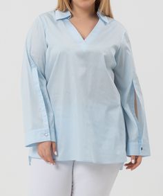 Lilou blouse is crafted from crisp 100% cotton, it features a spread collar merging seamlessly into a flattering V-neckline, it has long sleeves and button cuffs. Classic Fit. Material: 100% Cotton. Model wears size ‘S’. Chic Long Sleeve Blouse With Roll-up Sleeves, Fall V-neck Blouse With Placket, Spring V-neck Top With Unlined Sleeves, Chic Cotton Long Sleeve Top For Work, V-neck Blouse With Unlined Sleeves For Spring, V-neck Shirt With Placket For Spring, Spring V-neck Blouse With Unlined Sleeves, Spring Split Neck Blouse With Placket, Classic Split Neck Blouse For Spring