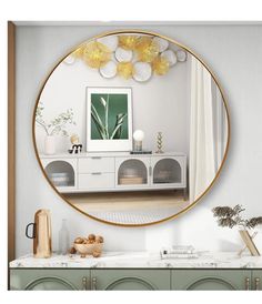 a mirror that is on the wall above a dresser