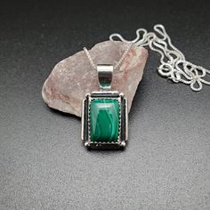 Visit our on-line shop at: Etsy.com/shop/AlbuquerqueDesigns *sterling silver necklace pendant *rectangle shape pendant with silver box chain necklace 18 inches long *southwestern jewelry *green malachite / green stone with matrix *calibrated pre-cut stones in millimeter and shape of stone: 14x10nn rectangle shape *back of jewelry items are all covered / do not show the back of stones *all jewelry items are made to ship, slight variations in stones will occur comparing to pictures. *size of a pen Silver Sterling Silver Necklace With Rectangular Stone, Green Rectangular Sterling Silver Jewelry, Spiritual Sterling Silver Rectangular Jewelry, Green Sterling Silver Rectangular Pendant, Green Sterling Silver Rectangular Pendant Jewelry, Green Sterling Silver Jewelry With Rectangular Pendant, Sterling Silver Rectangular Gemstone Necklace, Rectangular Sterling Silver Necklace With Gemstone, Rectangular Stamped 925 Necklace As Gift