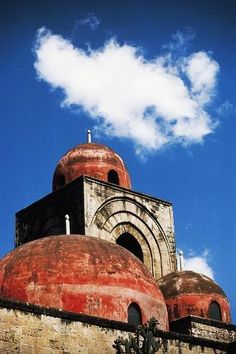 an old building with two domes on top