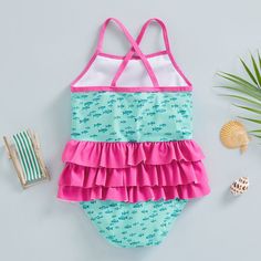 The perfect addition to your little one's summer wardrobe! Made from soft and stretchy fabric, this swimsuit is designed to keep your baby comfortable and stylish during their water adventures. The cute and colorful design with adorable ruffles will make your baby stand out on the beach or by the pool. Upf 50+ Swimwear For Beach Season Playtime, Summer Swimwear With Upf 50+ For Playtime, Blue Swimwear With Upf 50+ For Playtime, Upf 50+ Swimwear For Summer Playtime, Upf 50+ Swimwear For Summer, Cute Swimwear With Uv Protection For Vacation, Summer Beachwear Tankini For Playtime, Summer Beachwear Tankini, Playful Ruffled Swimwear For Summer