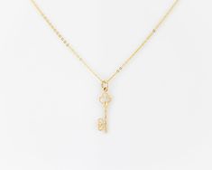 "\"KAYANA\" real vintage, 14k solid gold, dainty minimalist skeleton key pendant (on a complimentary gold plated sterling silver chain). The pendant features two interwoven hearts at the end of the key. We have two of these in stock that are identical, they go well together as a matching set- grab em while they're still available! (Just add two to cart- if only one is available then the other one has sold.) More necklaces: https://dvnejewelryco.etsy.com SIMILARLY: dainty gold plated sterling sil Gold Key Pendant Jewelry, Gold Pendant Jewelry With Keys, Elegant Two Keys Necklace As Gift, Elegant Two Keys Necklace Gift, Elegant Two Keys Necklace For Gift, Elegant Key Pendant Necklace, Yellow Gold Key Pendant Jewelry, Classic Jewelry With Keys For Gifts, Elegant Sterling Silver Key Jewelry