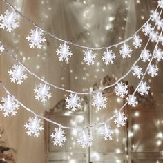 snowflake lights are hanging from the ceiling