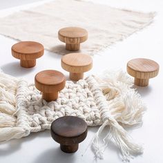 several wooden knobs on top of a white rug