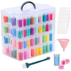 a plastic container filled with lots of different colored beads and tools next to each other