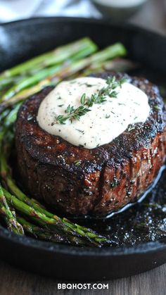 steak and asparagus in a cast iron skillet