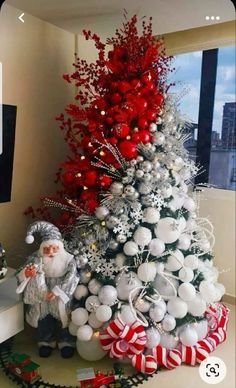 a christmas tree decorated with white and red ornaments