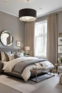 a bedroom with a large bed sitting next to a window covered in beige drapes