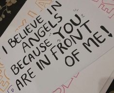 a piece of paper with writing on it that says i believe in angels, because you are infront of me