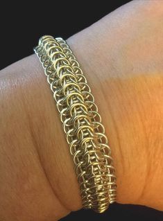 14k gold and Argentium silver dragonback chainmaille bracelet is a made to order item. It is made of Argentium silver with a row  of 14k gold down the center. It may take up to 3 weeks to receive your bracelet because I make the rings myself, then weave the bracelet one ring at a time. I prefer a rare earth magnetic clasp personally but we can use what ever clasp design you prefer.  Ships in a box suitable for gifting and with insurance and tracking. Jump Ring Jewelry, Pearl Cluster Earrings, Chainmail Bracelet, Chainmail Jewelry, Woven Ring, Chainmaille Bracelet, Chain Maille Jewelry, Chunky Earrings, Rainbow Jewelry