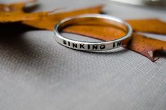 A solid sterling, personalized, stacking ring for every occasion - mother's gift, graduation, best friend ring, promise ring, anniversary, wedding or just because!   Words are powerful - what words do you want to keep close? You can have your words stamped on the inside and/or the outside - your choice. Want more than one? Here is the link to the money saving sets listing: https://boutonrougedesigns.etsy.com/listing/210312930 Prefer a gold version of this ring? See this listing: https://boutonro Meaningful Silver Stackable Rings, Meaningful Hand Stamped Stackable Rings For Anniversary, Meaningful Stackable Sterling Silver Rings, Meaningful Hand Stamped Stackable Promise Rings, Meaningful Stackable Promise Rings, Meaningful Silver Stackable Rings Gift, Silver Stackable Rings For Gift, Meaningful Style, Minimalist Hand Stamped Stackable Rings As Gift, Minimalist Hand Stamped Stackable Rings For Gift