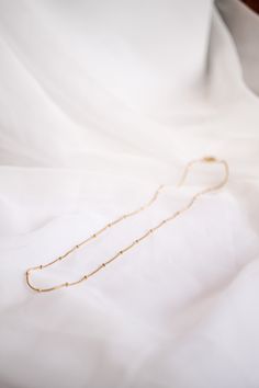 Satellite Chain necklace 18k gold plated stainless steel Hypoallergenic and Nickel Free Waterproof and Tarnish free! 18 inches in length Great for layering or wearing alone Staple piece The perfect everyday necklace! She is so dainty and easy to throw on with every outfit you could put together! We love her worn alone, and we also love her layered with other necklaces too! This piece is an ESSENTIAL piece every girl- of any age- needs in her wardrobe! Minimalist Tarnish Resistant Link Charm Necklace, Minimalist Hypoallergenic Snake Chain Necklace, Minimalist Charm Necklace With Delicate Snake Chain, Simple Gold Necklace With Paperclip Chain, Simple Gold Paperclip Chain Necklace, Minimalist Hypoallergenic Gold Necklaces, Minimalist Gold Chain Charm Necklace For Layering, Minimalist Charm Necklaces With Gold Chain For Layering, Minimalist 14k Gold Filled Snake Chain Necklace