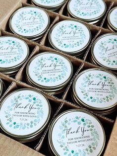 twelve wedding favors in a box with thank you stickers on the front and back