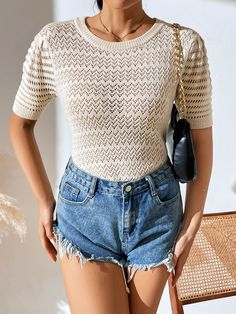 Get a perfor-mazing look with this Delphina knit top! A creamy delight boasting a perforated design, it'll be your go-to for any occasion and will make you look totally bella! Suitable for any stylish wardrobe, this top won't let you down. Size Guide: Influencer is 5’5” tall, and has a 33.4” bust, 24.7”waist, & 36.9” hips. She is wearing a S / US 4 / AU 8. This top is true to size. Material: 50% Viscose, 30% Polyester, 20% Acrylic. Key Features: Short sleeves. Crew Neckline. Soft Knit Fabricatio Summer Hollow Out Knit Tops, Summer Knit Hollow Out Tops, Chic Cream Crew Neck Knit Top, Cream Pointelle Knit Crew Neck Top, Spring Hollow Out Knit Top, Cream Pointelle Knit Top With Crew Neck, Fitted Beige Pointelle Knit Crochet Top, Short Sleeve Open Knit Top For Day Out, Beige Pointelle Knit Sweater For Day Out