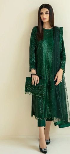 This green sequin straight kurta is made from designer sequin fabric which is eye catching in its look. This is kurta plazzo set .it is paired up with silk plazzo . Both the kurta and pants will have lining inside. We will collect your measurements as soon as the outfit is booked. Please feel free to contact us on etsy convo for further queries. Thank you Party Wear Simple Dresses Pakistani, Fancy Dress Designs Pakistani, Festive Straight Kurta Salwar Kameez With Sequins, Sequin Straight Kurta Salwar Kameez For Festivals, Sequin Embellished Straight Kurta Salwar Kameez For Festivals, Bollywood Style Salwar Kameez With Sequins, Bollywood Style Straight Kurta Salwar Kameez With Sequins, Semi-stitched Sequined Anarkali Set With Straight Kurta, Green Mirror Work Dupatta