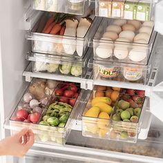 the refrigerator door is open and filled with lots of fresh fruits and veggies